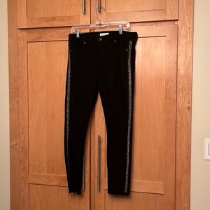 Black stretch jeans /silver beaded sides. 68% cotton, 22% polyester Machine wash